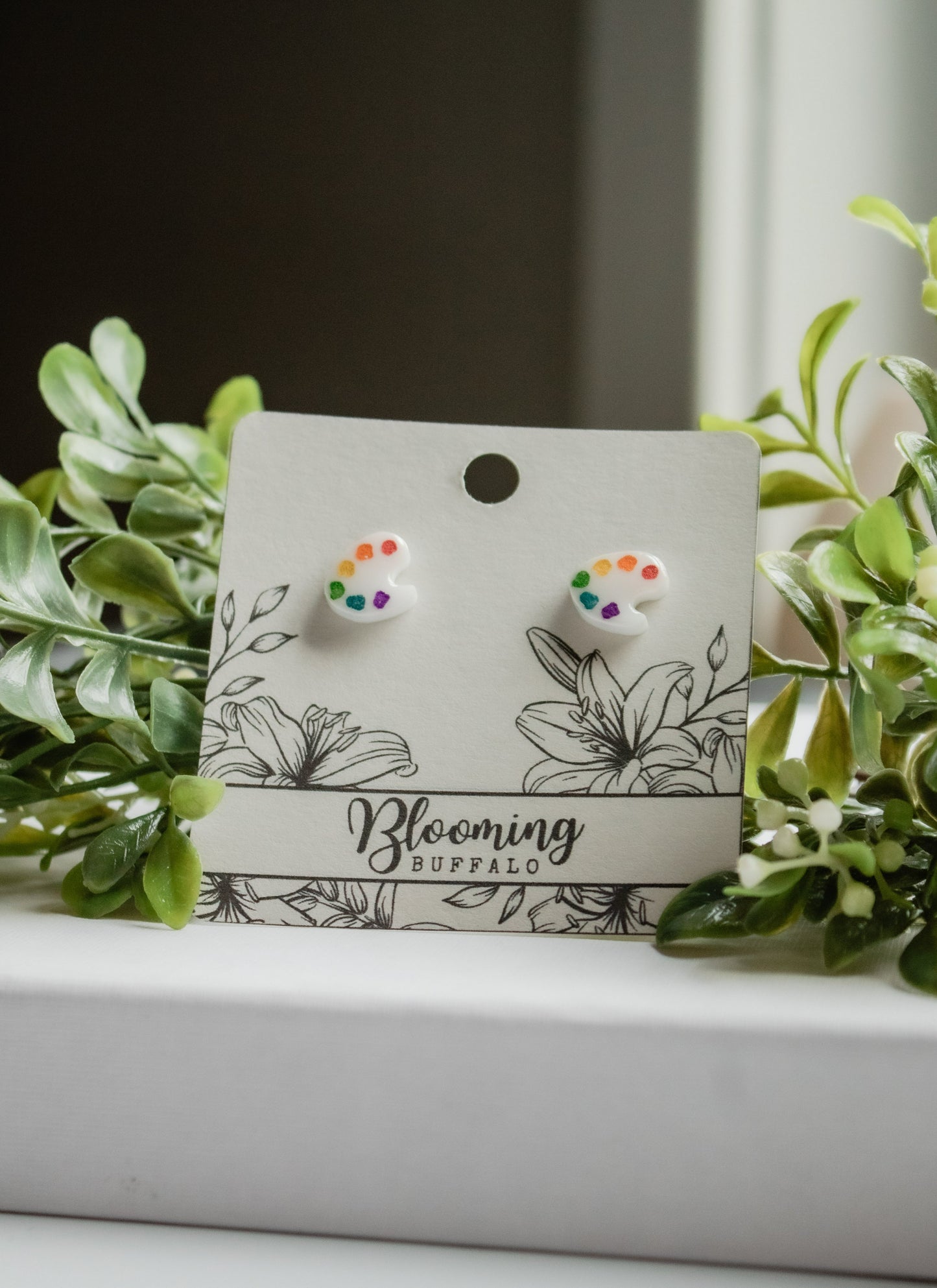 White acrylic artist palette stud earrings with rainbow paint