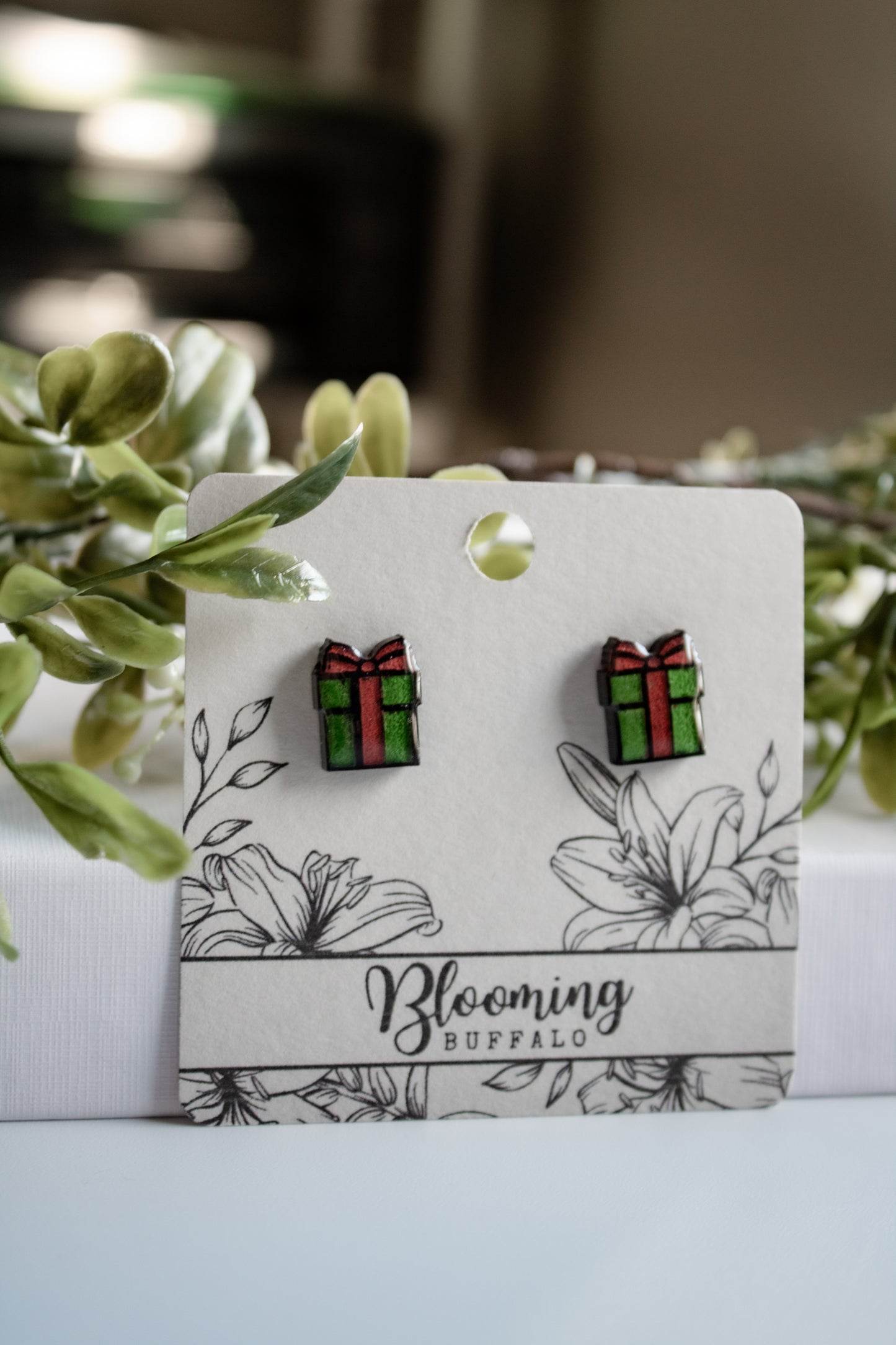 vibrant red and green christmas gift stud earrings on Blooming Buffalo branded earring card
