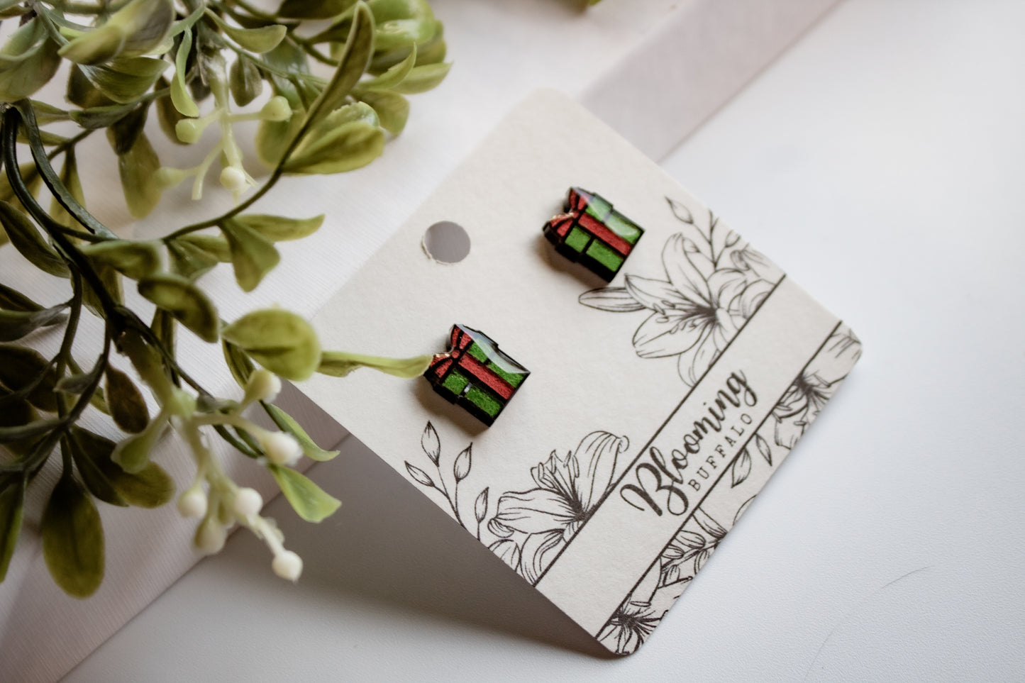 vibrant red and green christmas gift stud earrings on Blooming Buffalo branded earring card