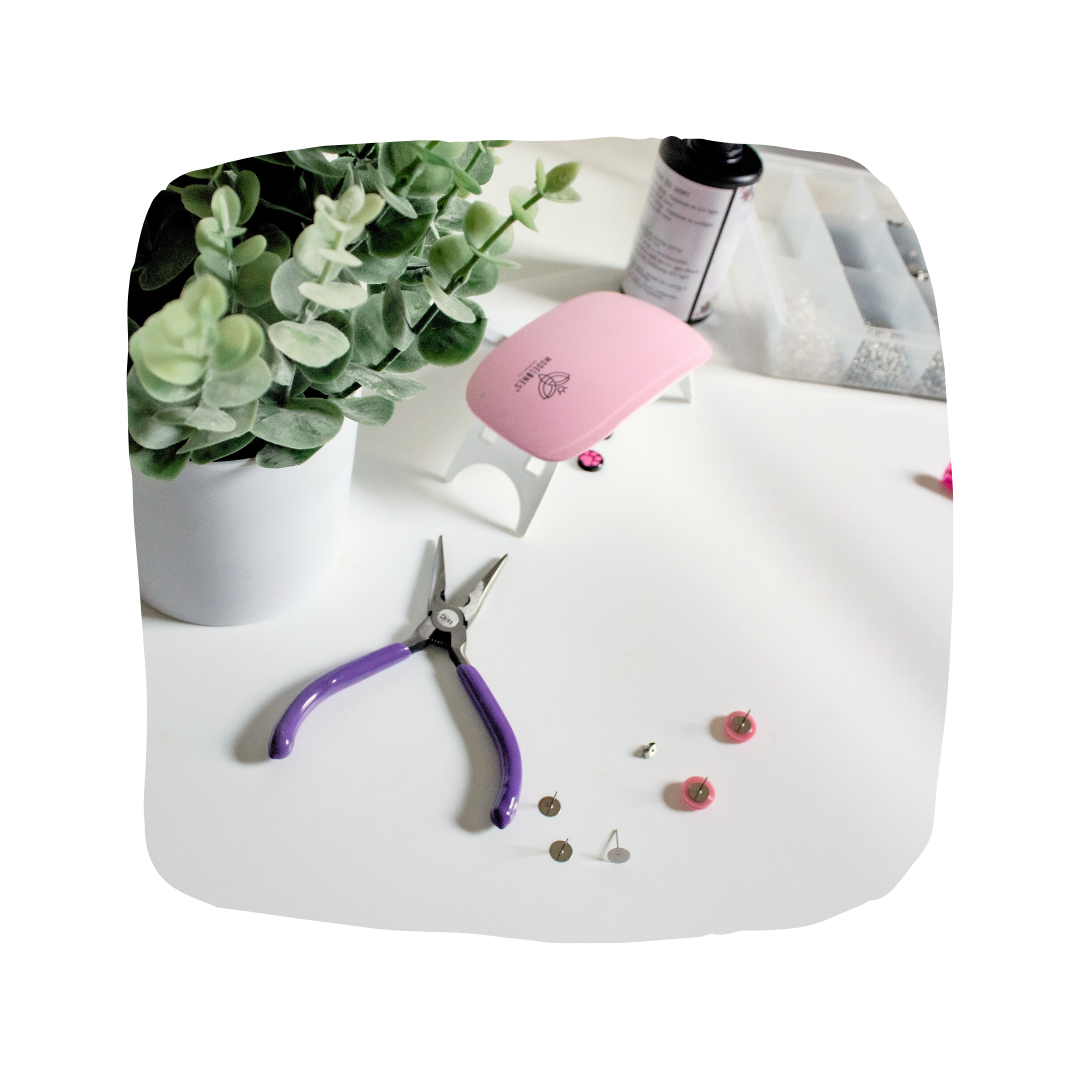 A bright workstation featuring jewelry making supplies.