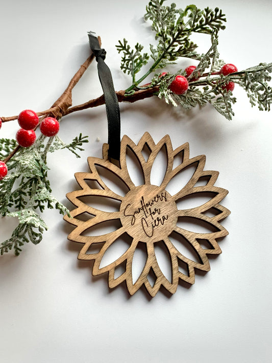 wooden sunflower ornament with sunflowers for ciera engraved in the middle. 